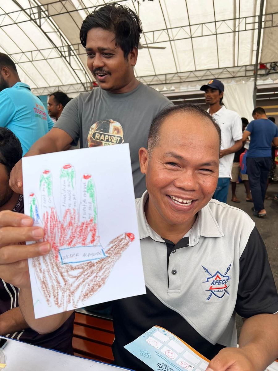 Portrait of [NAME] holding their artwork