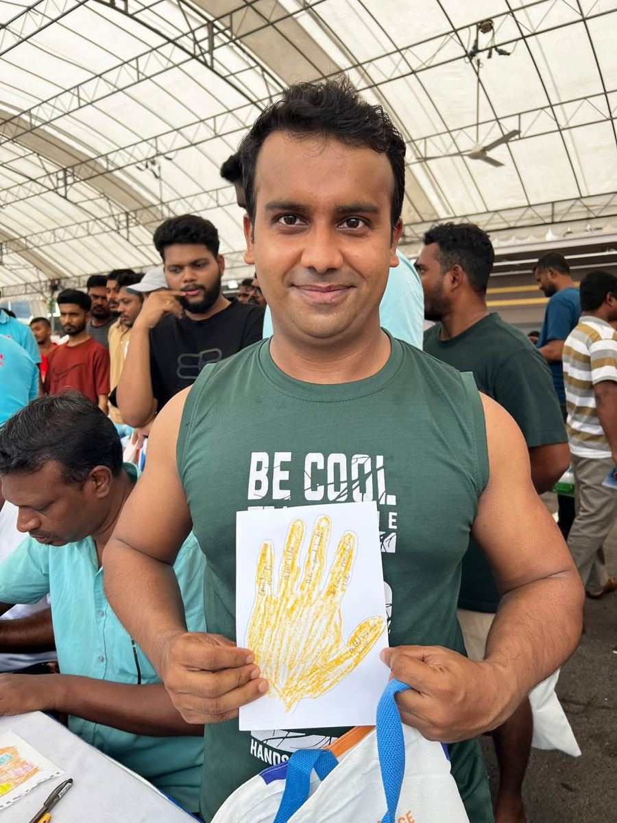 Portrait of [NAME] holding their artwork