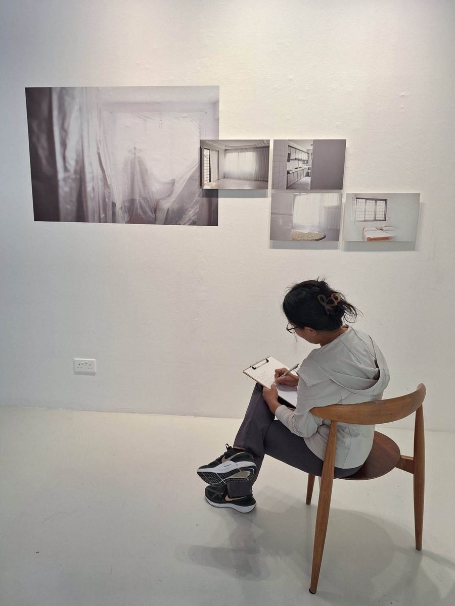 Participant writing at an MWS workshop, [NAME / DESCRIBE]