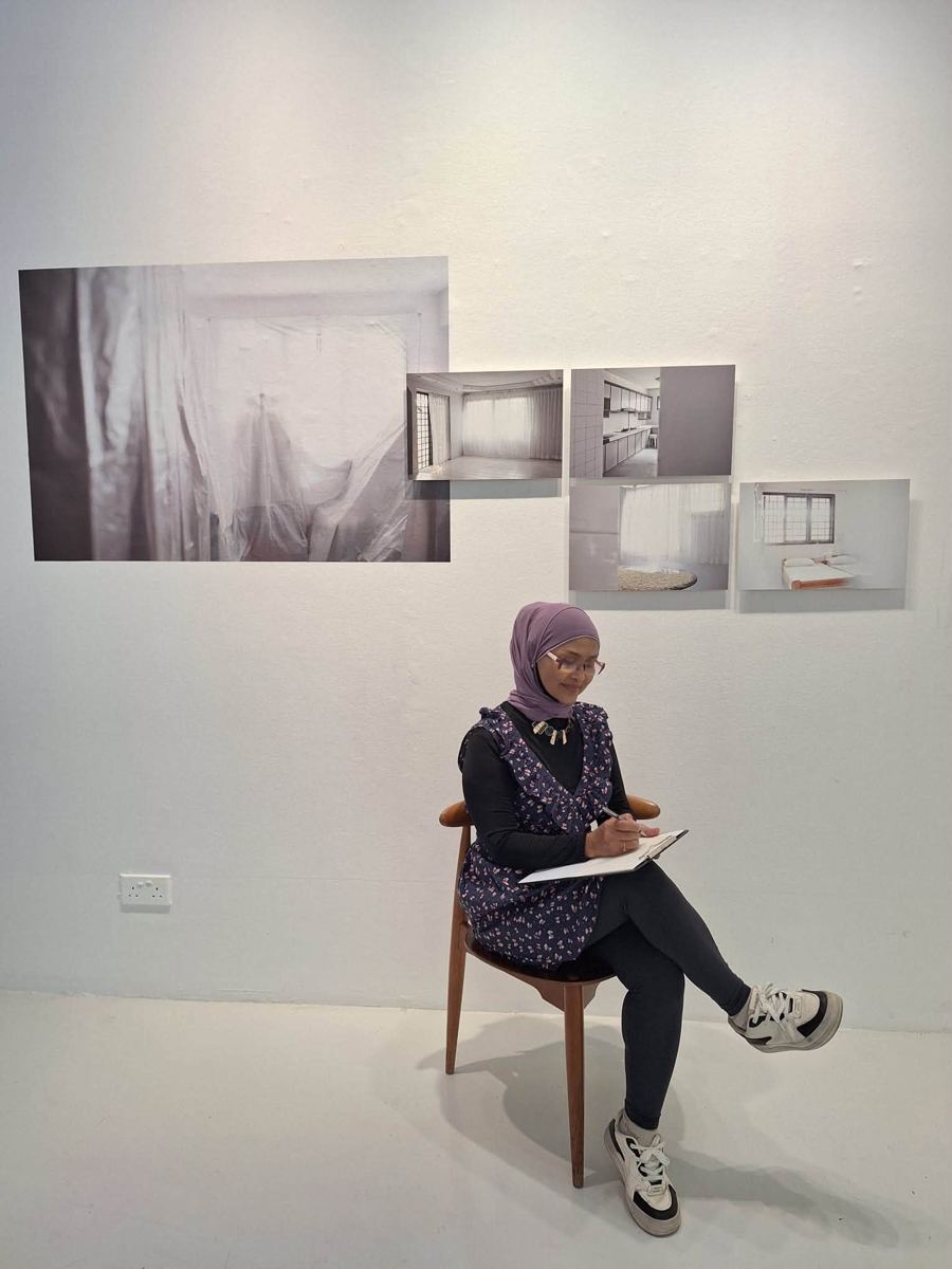 Participant writing at an MWS workshop, [NAME / DESCRIBE]